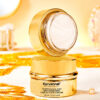 Cosmetic product with gold accents on a white background